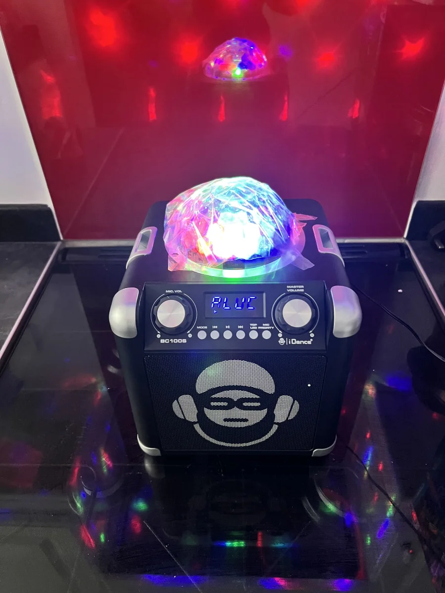 Bluetooth Speaker with Disco Ball Light action shot 1