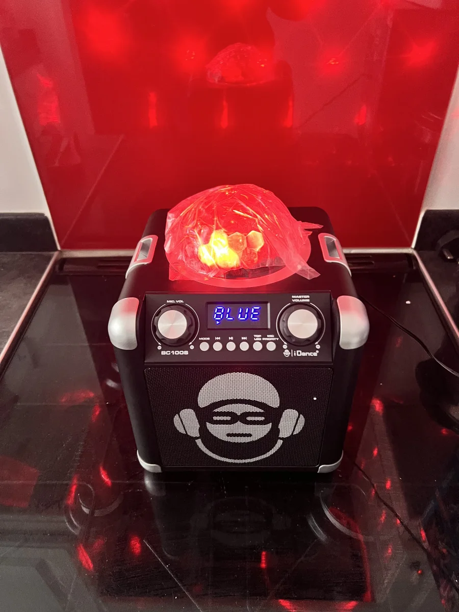 Bluetooth Speaker with Disco Ball Light action shot 2